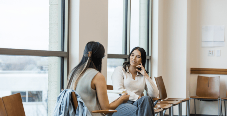 women discussing apprenticeship progress review process