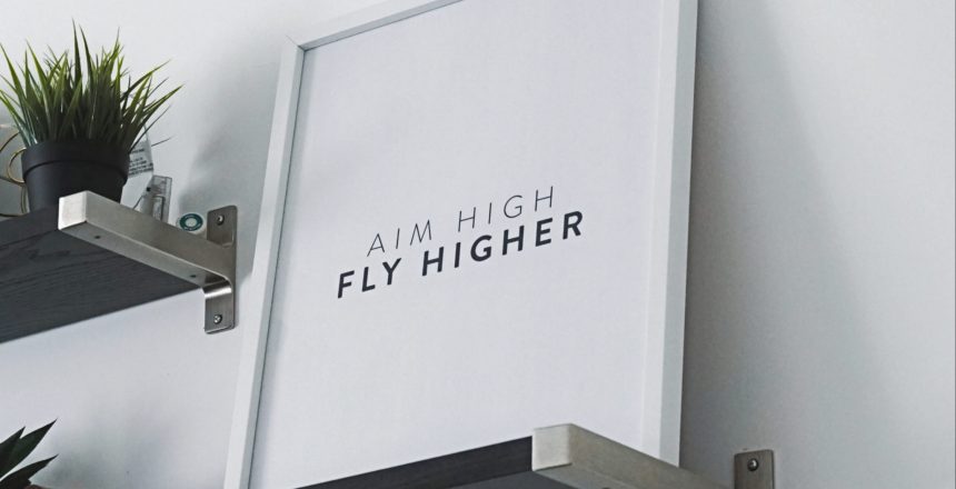 aim high, fly higher motivational poster