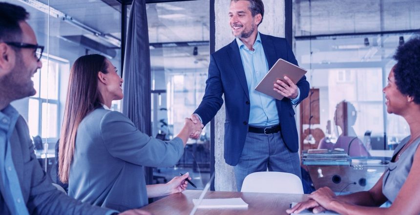 business people shaking hands to confirm vocational technology agreement